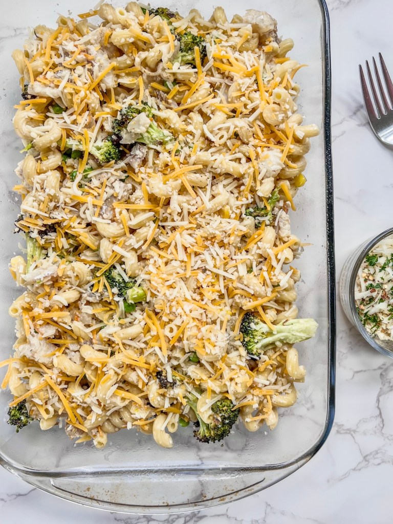 A creamy fish casserole just before getting topped with a breadcrumb mixture and baked.